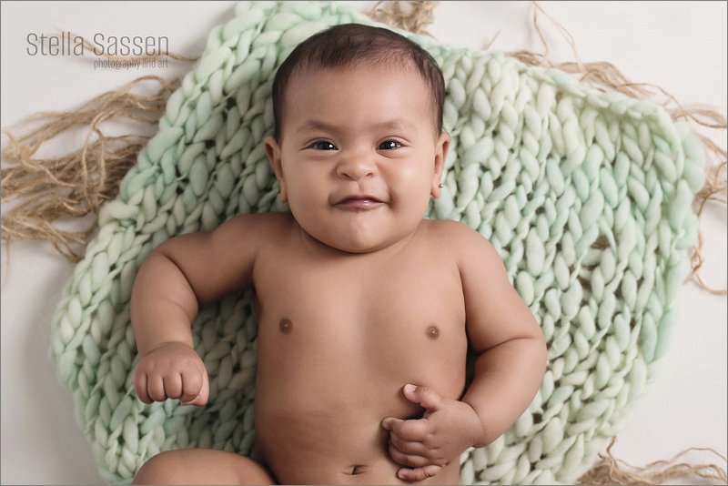 toddler baby looking at camera sitter photo shoot