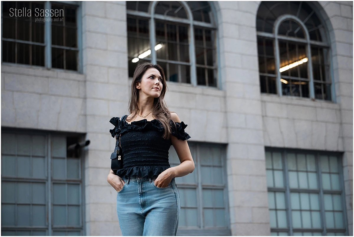 Model in the urban streets of Cape Town posing in front of a building
